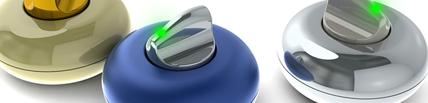 A close-up of three round, donut-shaped devices in shiny gold, matte blue, and chrome, all with metal knobs sporting a glowing green light in the top middle.