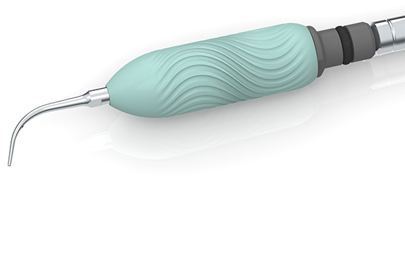 A prototype dental grip is shown, which contains wavy lines to help provide additional grip texture.