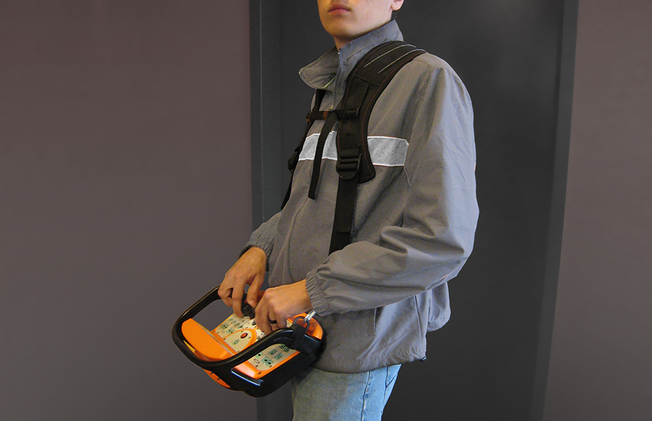 A person is shown using the Continuous Mining Remote while it is held by a harness. A person is shown using the Continuous Mining Remote while it is held by a harness.