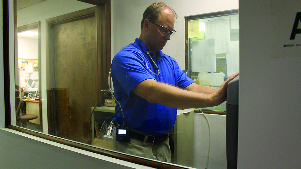 A person is shown in an office wearing the SKC PcoketPump TOUCH.