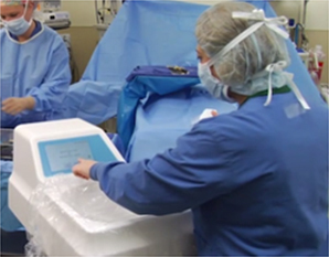 A clinician is shown interaction with the RFID basin in a surgical suite.